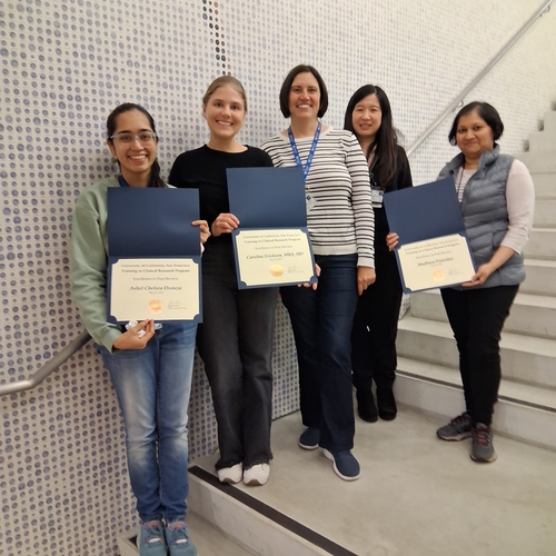 Students with the program directors receiving their awards