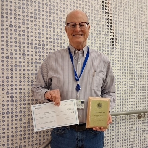 Chuck receiving his award