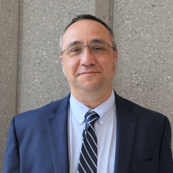 Professional headshot of John Kornak