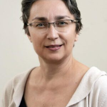 A professional headshot of Catherine