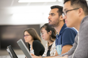 Students with computers in lecture 