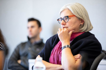 Woman listening to a lecture