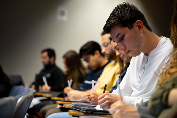 students writing in lecture